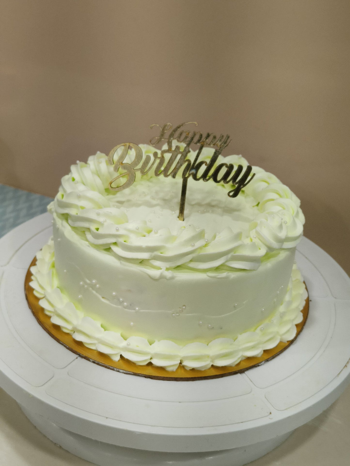 Classic yellow Birthday Cake with Elegant Detailing
